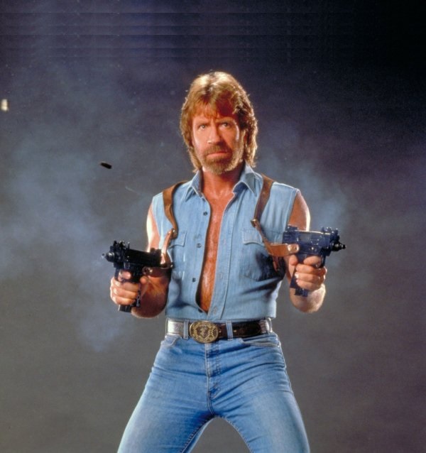 Chuck Norris with machine guns